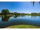 Serene lake view showcasing community condos and lush greenery at 4426 Pelorus Dr # 4426, New Port Richey, FL 34652