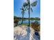 Peaceful lakefront patio with potted plants and tranquil waters at 4426 Pelorus Dr # 4426, New Port Richey, FL 34652