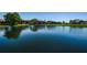 Stunning lake view reflecting the surrounding condos and trees at 4426 Pelorus Dr # 4426, New Port Richey, FL 34652