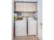 Laundry room with washer, dryer, and overhead cabinets at 4426 Pelorus Dr # 4426, New Port Richey, FL 34652