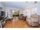 Living room with TV and sliding doors at 4426 Pelorus Dr # 4426, New Port Richey, FL 34652