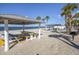 Relaxing beach area with picnic tables and grills at 4515 Marine Pkwy # 102, New Port Richey, FL 34652