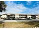 Two-story condo building with covered parking and lush landscaping at 4515 Marine Pkwy # 102, New Port Richey, FL 34652