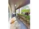 Covered walkway leading to condo units with landscaping at 4515 Marine Pkwy # 102, New Port Richey, FL 34652