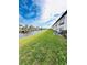 Scenic waterfront view with lush grass and canal at 4515 Marine Pkwy # 102, New Port Richey, FL 34652