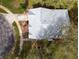 Top-down view of a single story house showcasing its grey roof and landscaping at 4912 Enfield Ct, New Port Richey, FL 34655