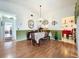 Bright dining room with hardwood floors and a table set for four at 4912 Enfield Ct, New Port Richey, FL 34655
