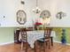 Bright dining room with wood floors and a table set for four at 4912 Enfield Ct, New Port Richey, FL 34655
