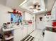 White kitchen with ample counter space and black appliances at 4912 Enfield Ct, New Port Richey, FL 34655