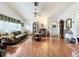 Bright living room with hardwood floors, comfortable seating, and ample natural light at 4912 Enfield Ct, New Port Richey, FL 34655