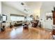 Living room with hardwood floors, comfortable seating, and large windows at 4912 Enfield Ct, New Port Richey, FL 34655