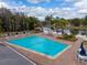 Community pool with lounge chairs and a gazebo at 4912 Enfield Ct, New Port Richey, FL 34655