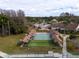 Community shuffleboard courts with covered areas and benches at 4912 Enfield Ct, New Port Richey, FL 34655