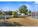 Backyard with pool, shed, and white fence at 5948 Lyon Rd, Spring Hill, FL 34606