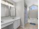 Main bathroom with dual sinks, a soaking tub and shower at 5948 Lyon Rd, Spring Hill, FL 34606