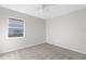 Simple bedroom with grey carpet and a window at 5948 Lyon Rd, Spring Hill, FL 34606