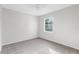 Bright bedroom with grey carpet and ceiling fan at 5948 Lyon Rd, Spring Hill, FL 34606