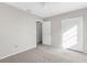 Well-lit bedroom with double door closet and carpet flooring at 5948 Lyon Rd, Spring Hill, FL 34606
