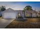 House exterior with two-car garage at 5948 Lyon Rd, Spring Hill, FL 34606