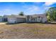 Tan house with two car garage at 5948 Lyon Rd, Spring Hill, FL 34606