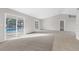 Spacious living area with pool view and sliding glass doors at 5948 Lyon Rd, Spring Hill, FL 34606