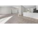Spacious living room with carpet flooring and an open floor plan at 5948 Lyon Rd, Spring Hill, FL 34606