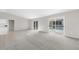 Spacious living room with sliding doors leading to the pool area at 5948 Lyon Rd, Spring Hill, FL 34606