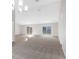Bright living room with sliding glass doors leading to the pool at 5948 Lyon Rd, Spring Hill, FL 34606