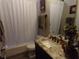 Clean bathroom with granite countertop, shower, and bathtub at 6216 Montana Ave, New Port Richey, FL 34653