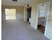 Spacious bedroom with access to bathroom and sliding doors to patio at 705 Churchill Pl, Sun City Center, FL 33573