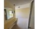 Bedroom with built-in vanity and mirrored closet doors at 705 Churchill Pl, Sun City Center, FL 33573