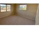 Spacious bedroom with large windows and neutral carpeting at 705 Churchill Pl, Sun City Center, FL 33573