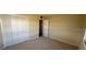 Well-lit bedroom featuring a double door closet at 705 Churchill Pl, Sun City Center, FL 33573