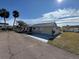 Front view of single-story home showcasing landscaping and driveway at 705 Churchill Pl, Sun City Center, FL 33573