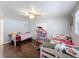 Twin bedroom with colorful bedding and toys at 7345 Fireside Dr, Port Richey, FL 34668