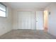 Bedroom with large closet and door to hallway at 7714 Jasmine Blvd, Port Richey, FL 34668