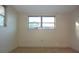 Well-lit bedroom with double window at 7714 Jasmine Blvd, Port Richey, FL 34668