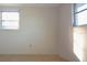 Empty bedroom with neutral colored walls and carpet flooring at 7714 Jasmine Blvd, Port Richey, FL 34668