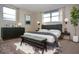 Main bedroom with a plush bed, dark dresser, and plenty of natural light at 7714 Jasmine Blvd, Port Richey, FL 34668