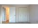 Bedroom with large closet and door to another bedroom at 7714 Jasmine Blvd, Port Richey, FL 34668