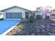 House exterior with driveway and landscaping at 7714 Jasmine Blvd, Port Richey, FL 34668