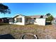 Exterior view of house with yard and shed at 7714 Jasmine Blvd, Port Richey, FL 34668