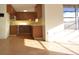 Bright kitchen with wood cabinets, yellow tile backsplash and tile flooring at 7714 Jasmine Blvd, Port Richey, FL 34668