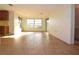 View of a spacious living area with light wood tile flooring at 7714 Jasmine Blvd, Port Richey, FL 34668