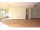 Spacious living area with tile floors and sunroom access at 7714 Jasmine Blvd, Port Richey, FL 34668