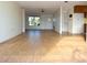 Living room with light wood tile flooring, and a view of the front door at 7714 Jasmine Blvd, Port Richey, FL 34668