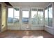 Sunroom with tiled floor and backyard view at 7714 Jasmine Blvd, Port Richey, FL 34668