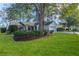 One story house with mature landscaping and a large tree in front at 8111 Sugarbush Dr, Spring Hill, FL 34606