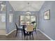 Bright dining area with bay window and glass-top table at 8362 Durham St, Spring Hill, FL 34608