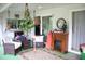 Relaxing screened porch with wicker furniture and fireplace at 8603 Forest Glade Dr, Hudson, FL 34667